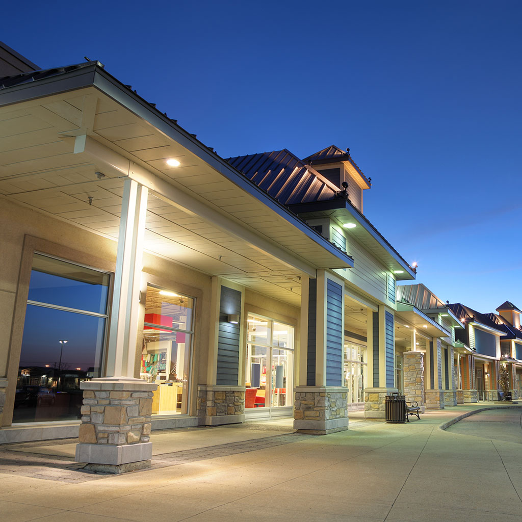 Store building exteriors at sunset